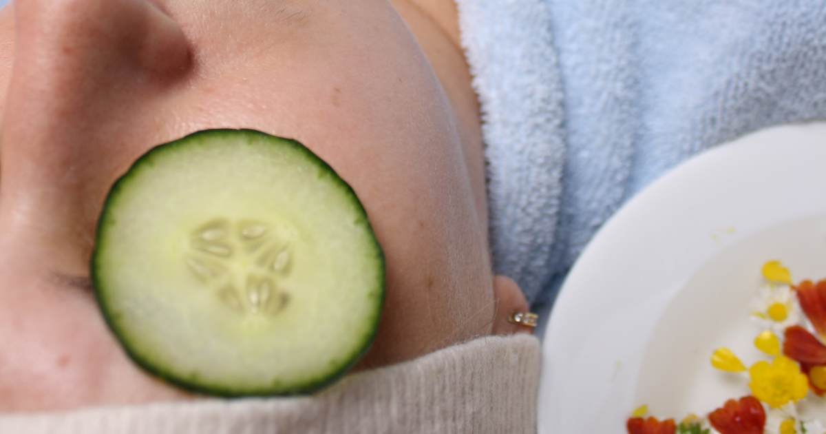 a close up of a person holding a bowl of fruit on a plate